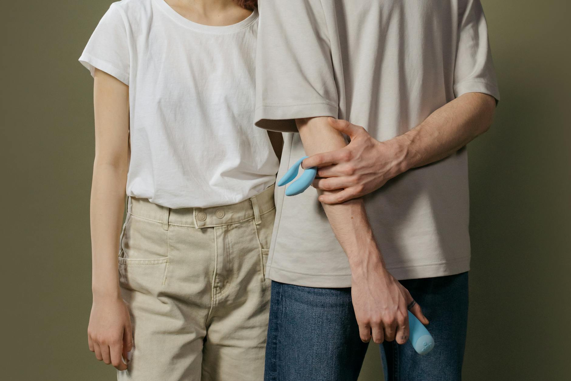 A young couple standing together indoors, symbolizing intimate reconnection